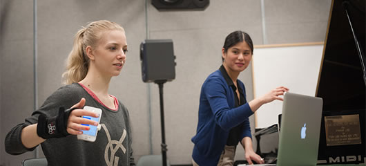 Pieteke MacMahon rehearses with an iPhone Piano app developed by members of UBC’s Laptop Orchestra. Photo: Martin Dee