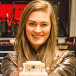 UBC Okanagan mechanical engineering student Jessica Van Brummelen holds the prototype of a smartphone-based POC lab.