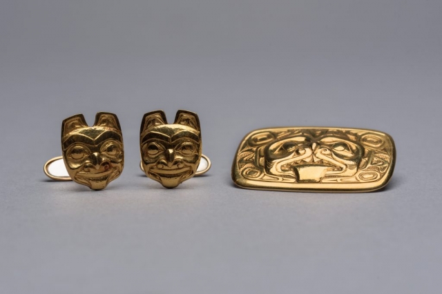 Gold cufflinks with a grizzly-bear motif (left), circa 1957, and a gold brooch with a dogfish motif (right), circa 1963—both created by renowned Haida artist Bill Reid—are part of a collection donated to the Museum of Anthropology by late Calgary philanthropist Margaret (Marmie) Perkins Hess. Credit: Martin Dee/University of British Columbia