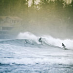 Surfers ride the waves at Cox Bay in Tofino, on the west coast of Vancouver Island. Credit: Tucker Sherman/Flickr