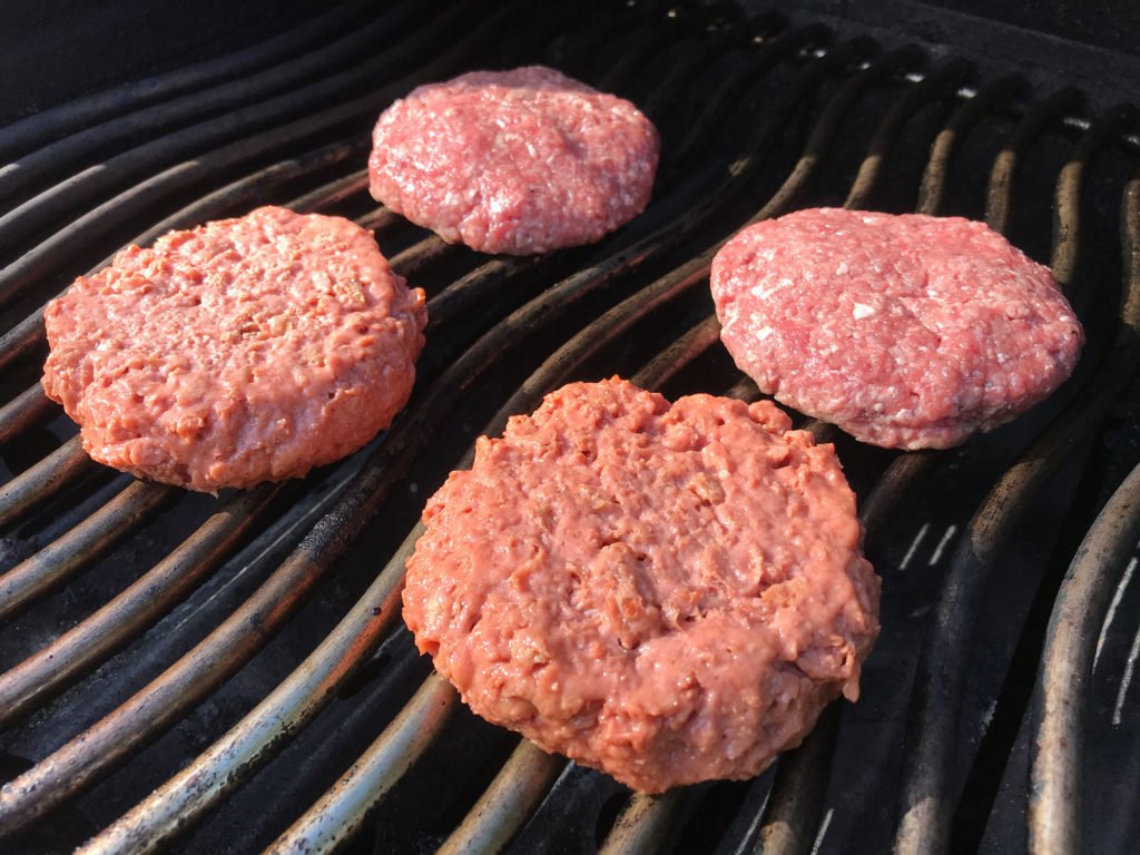 Beyond Meat burgers on the grill