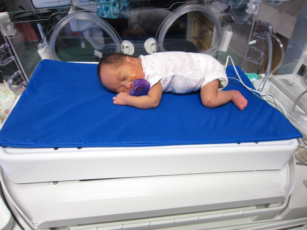 Premature baby resting on Calmer in the NICU at BC Children's Hospital. Photo credit: Liisa Holsti
