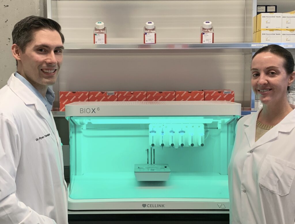 Dr. Ryan Flannigan and research assistant Meghan Robinson with bioprinter