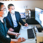 Senior author Dr. François Jean and co-author Dr. Guang Gao at UBC LSI imaging facility where they routinely capture high-resolution microscopy images of human cells infected with SARS-CoV-2. Credit: Paul Joseph