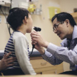 Dr. Edmond Chan provides care to a young patient. Credit: BC Children's Hospital Foundation