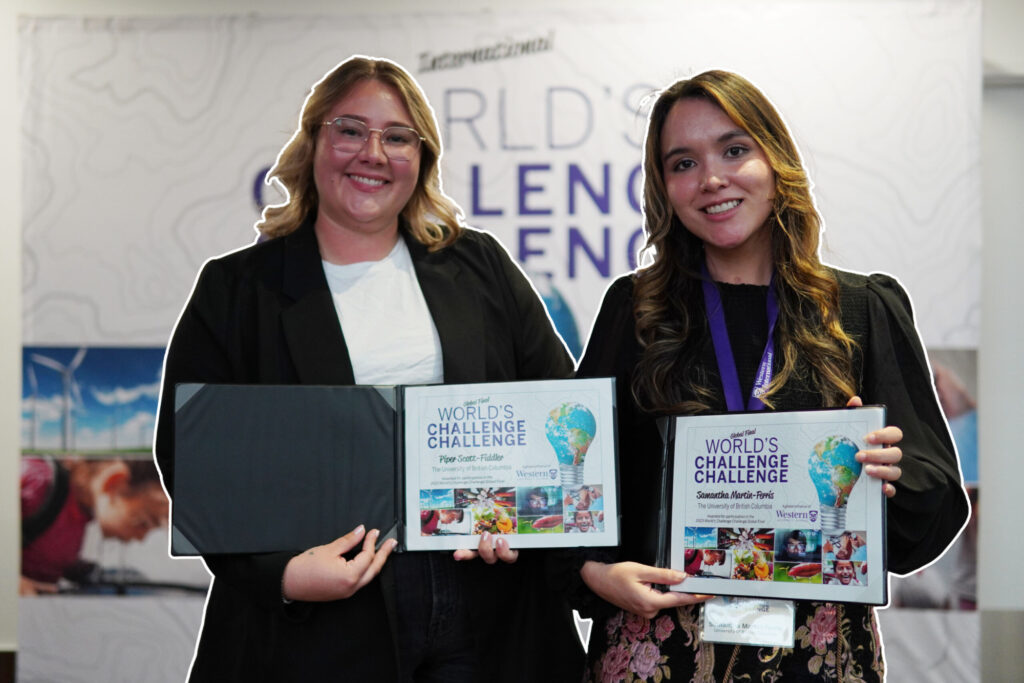 Piper Scott-Fiddler and Samantha Martin-Ferris holding their World's Challenge Challenge certificates.