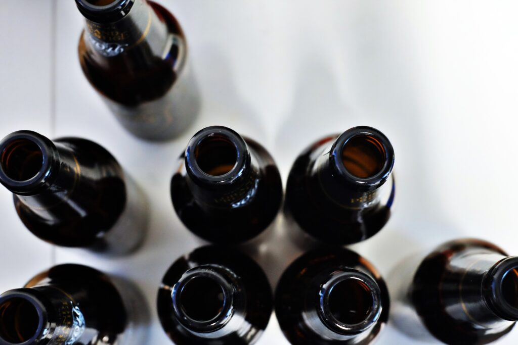 Overhead view of open beer bottles