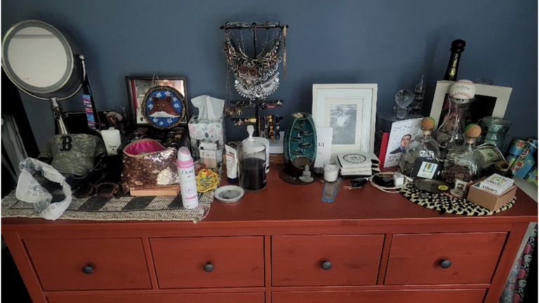 Image of a dresser with feminine products to the left and masculine products to the right.