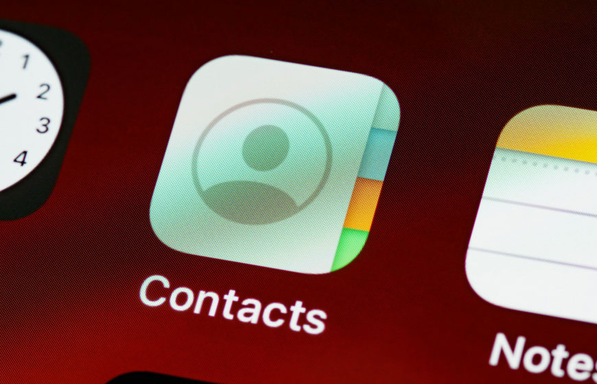 Close-up of contacts icon on a phone