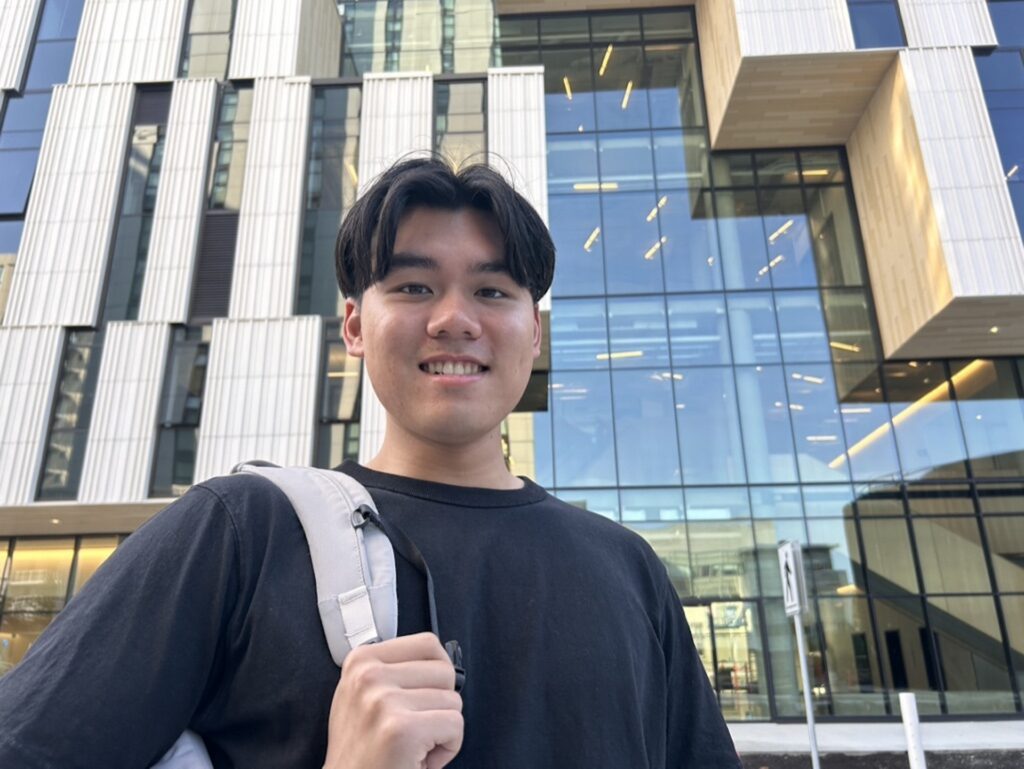 Peter Pham standing outside Brock Commons South building.