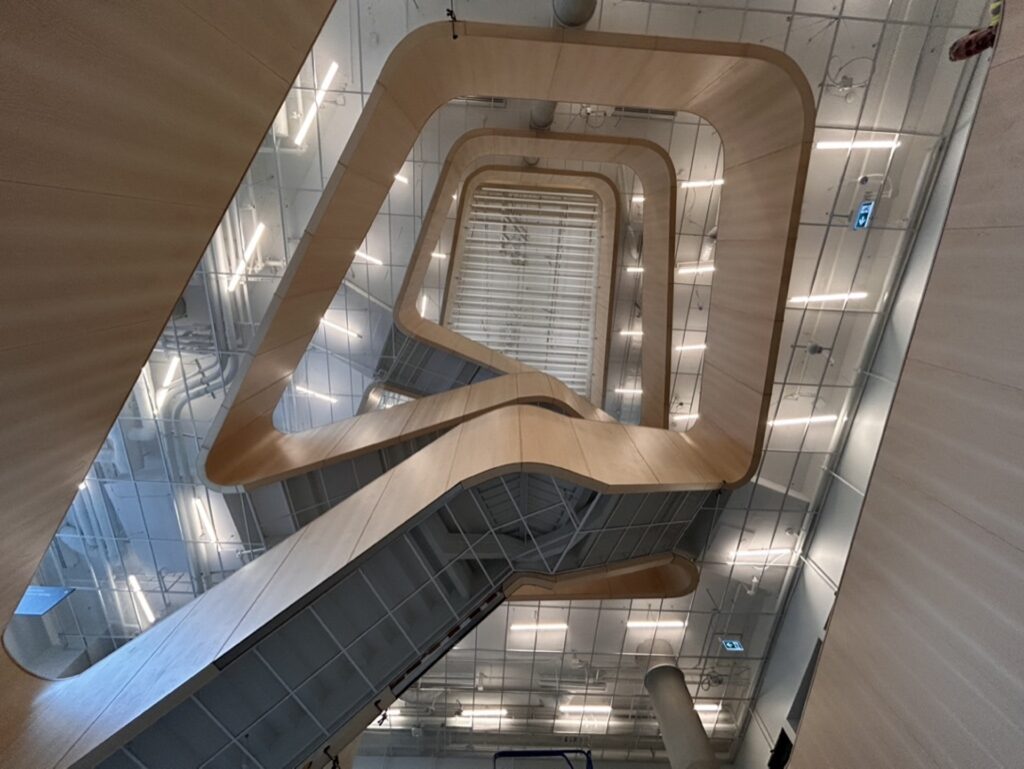 Interior view of Brock Commons South, showcasing a spiraling staircase.