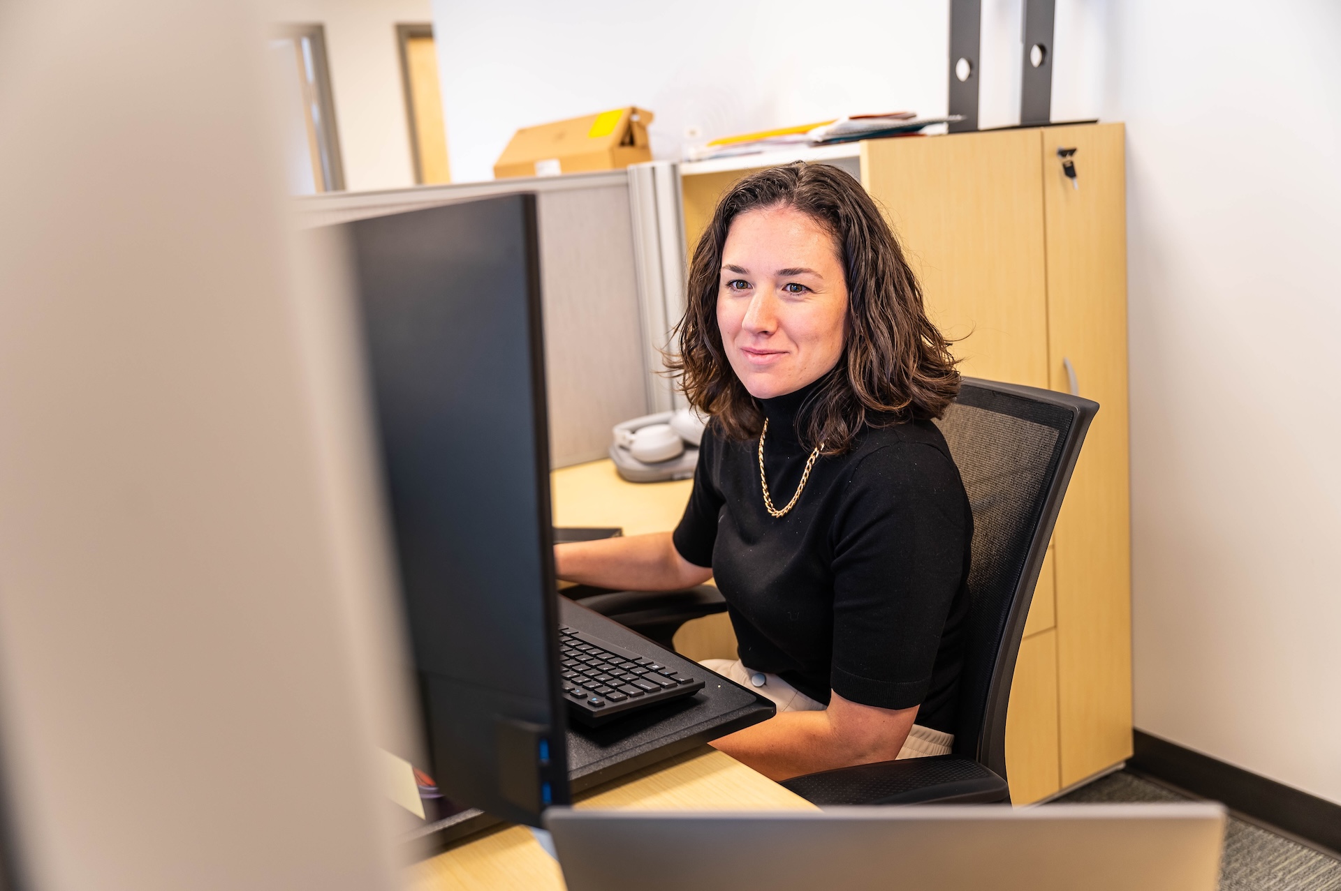 Professional woman working on her laptop to earn a micro-credential